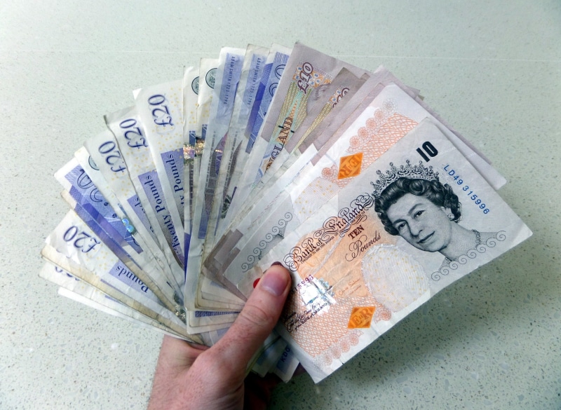 incentive, win money, make money, pounds, rich, sterling, notes, save money, cash, wealth, white background, human limb, jackpot, liquidity, one person