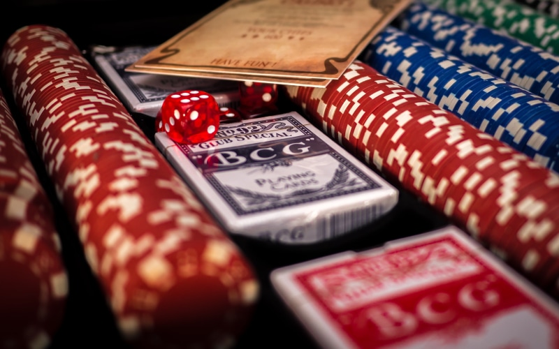 multi colored, floral pattern, assorted, red, wealth, chips, relaxation, close-up, playing, studio shot, no people, poker, selective focus, full frame