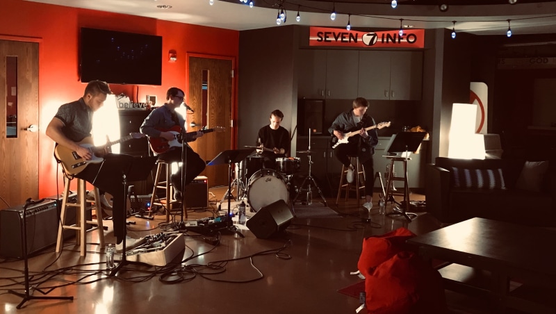 musician, sitting, musical instrument, band, group of people, pianist, young adult, performing, percussion, drum kit, flooring, guitar, performance group