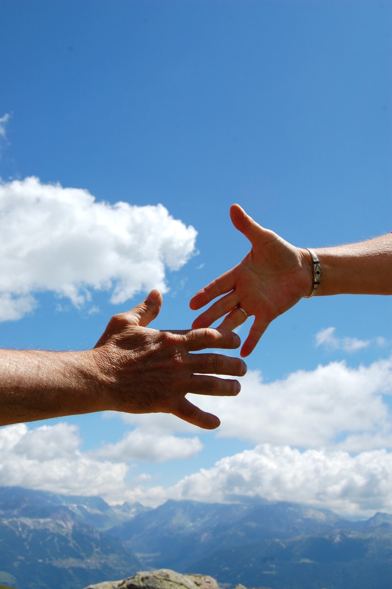 sky, success, women, togetherness, human arm, reaching, adult, two people, finger, teamwork, blue, couple - relationship, body part, optimism, real people