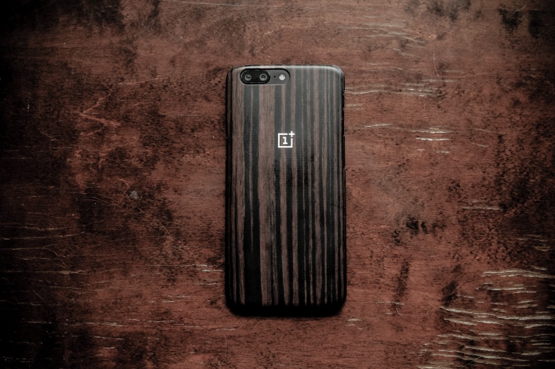wood on wood, old, ux, single object, black color, oneplus phone, communication, protection, oneplus5, push button, close-up, wood - material, technology