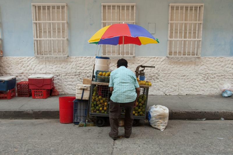 produce, car, man, rear view, bogotum, full length, lifestyles, cart, food, 4K, men, vendor, rain, standing, trader, adult, fruit, built structure, lemons