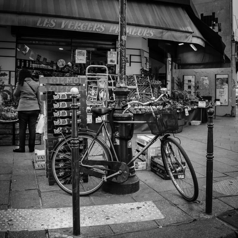 street food, architecture, bicycle, building exterior, transportation, paris, one person, outdoors, street, footpath, men, incidental people, land vehicle
