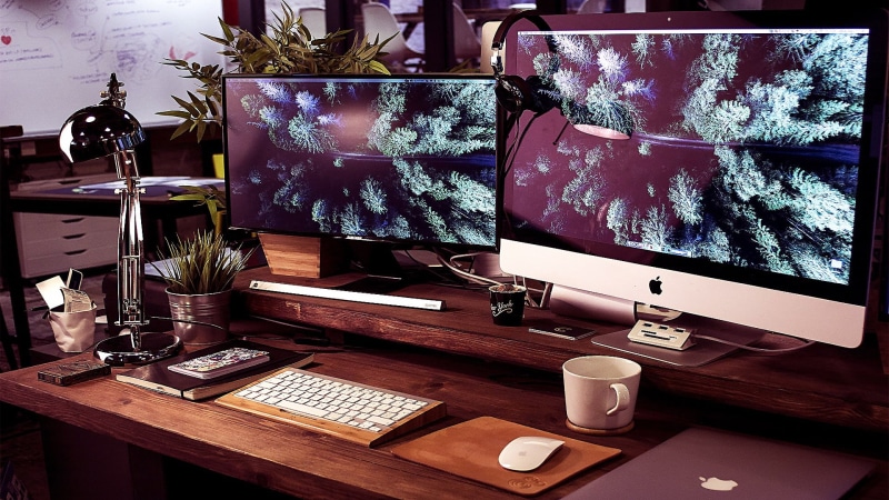 workstation, connection, food and drink, wood - material, work, mug, communication, furniture, coffee cup, electric lamp, home interior, table, computer