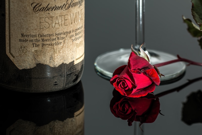 beauty in nature, flower head, beverage, romantic, red rose, nature, flower, affair, alcohol, vintage, wine, near, drink, no people, plant, petal, photo