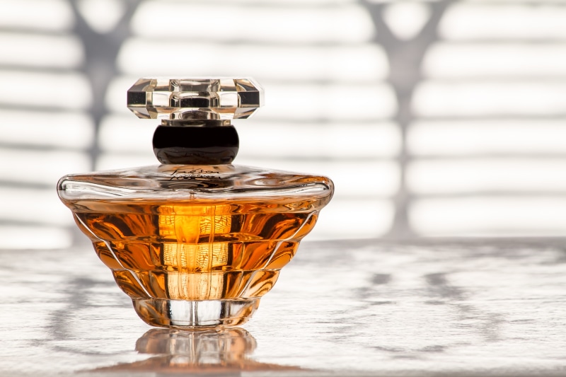 table, flacon, no people, shiny, cosmetics, still life, glass, food and drink, drink, refreshment, perfume, close-up, household equipment, day, focus on foreground