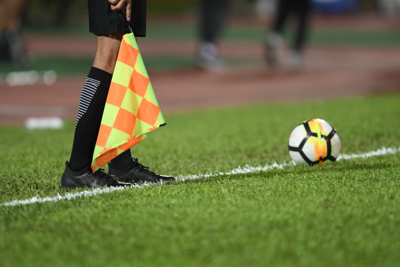 soccer, arbiter, soccer ball, human leg, outdoors, white, soccer field, ball, goal, low section, human body part, symbol, holding, 5K, linesman, human limb