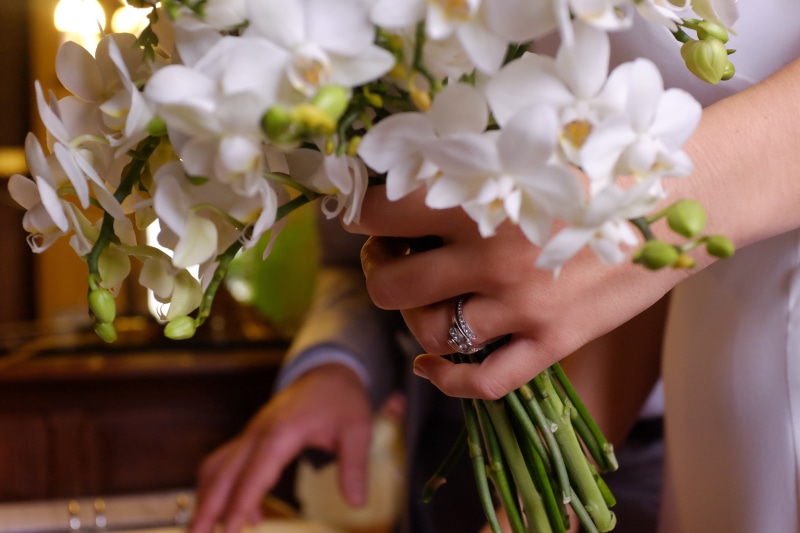 pure, hand, fragility, beauty in nature, two people, close-up, ring, people, wedding ring, adult, women, nature, bouquet, human body part, white, plant