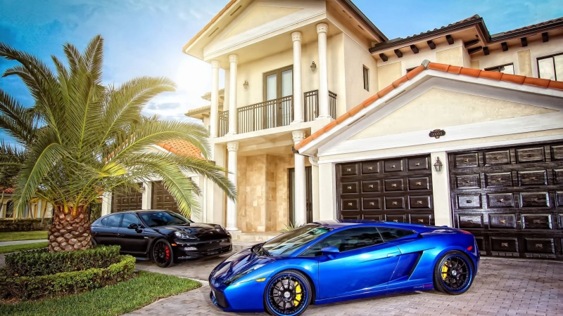 car, built structure, mode of transportation, symbol, plant, vintage car, stationary, sky, modern, residential, building exterior, house, city, tropical climate