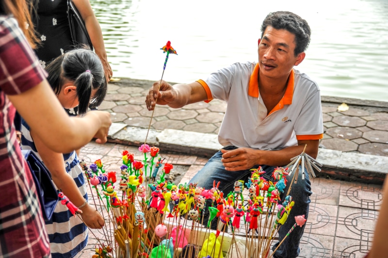 people, men, plant, lifestyles, flowering plant, day, life, market, two people, poor, standing, classic, salesman, traditional, adult, man, vietnamese