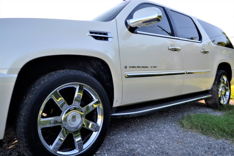 field, protection, escalade, raised, angle, parking, pre-owned, used car sales, drive, land vehicle, safety, outdoors, travel, automobile, city, suv, sky