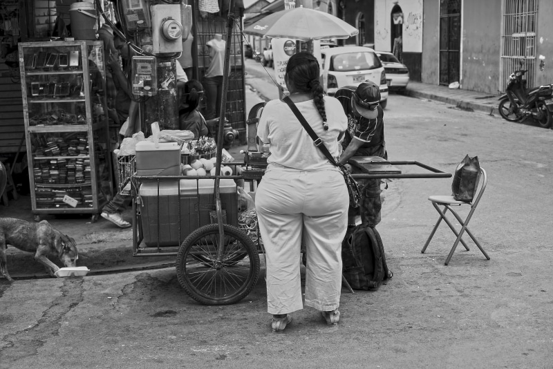 lifestyles, nicaragua, sony alpha 7 s, building exterior, store, full length, rear view, city, outdoors, leisure activity, salesman, casual clothing, sitting