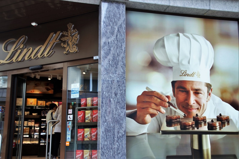 happiness, food and drink, clothing, photo gallery, tasty, lindt, the elegance, stall, fashionable brand, famous, buy, trend, people, males, smiling, young adult