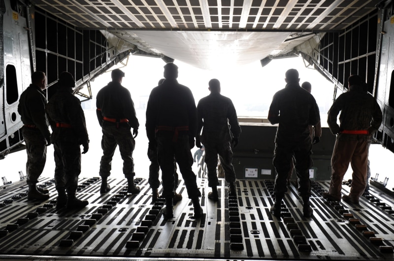lifestyles, transportation, walking, real people, tunnel, indoors, group, galaxy, silhouettes, people, airplane, teamwork, photo, ground, c5, crew, task