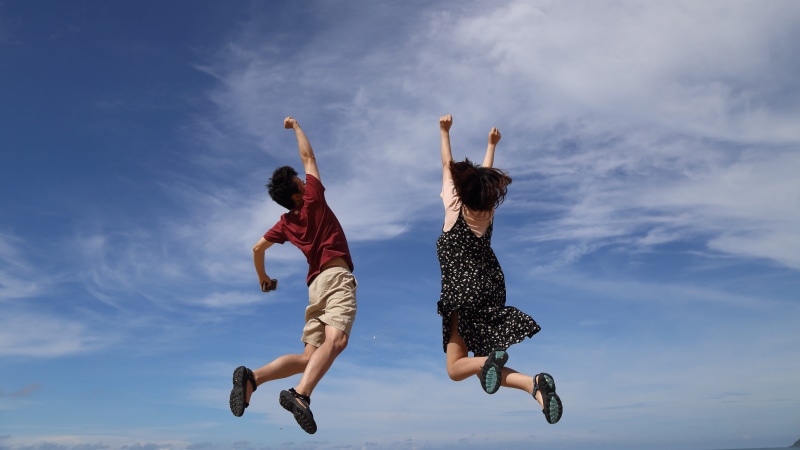 hooray, arms raised, teenager, sky, outdoors, people, motion, upwards, casual clothing, man, human arm, positive emotion, togetherness, jumping, blue, woman