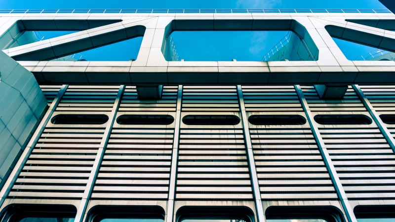 architecture, low angle view, city, nature, sunlight, facade, window, upward, building exterior, built structure, pattern, 5K, building, daytime, backgrounds