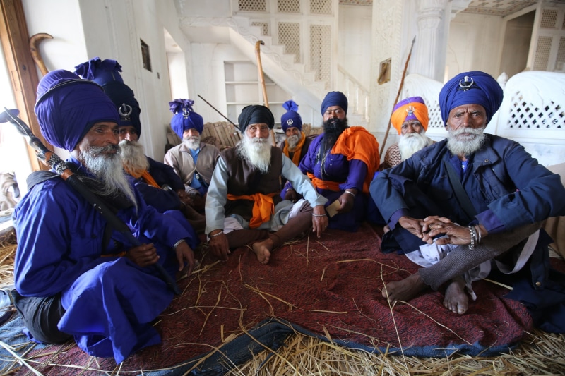 architecture, women, anandpur sahib, holla mohalla, festival, day, looking at camera, india, clothing, medium group of people, men, portrait, togetherness
