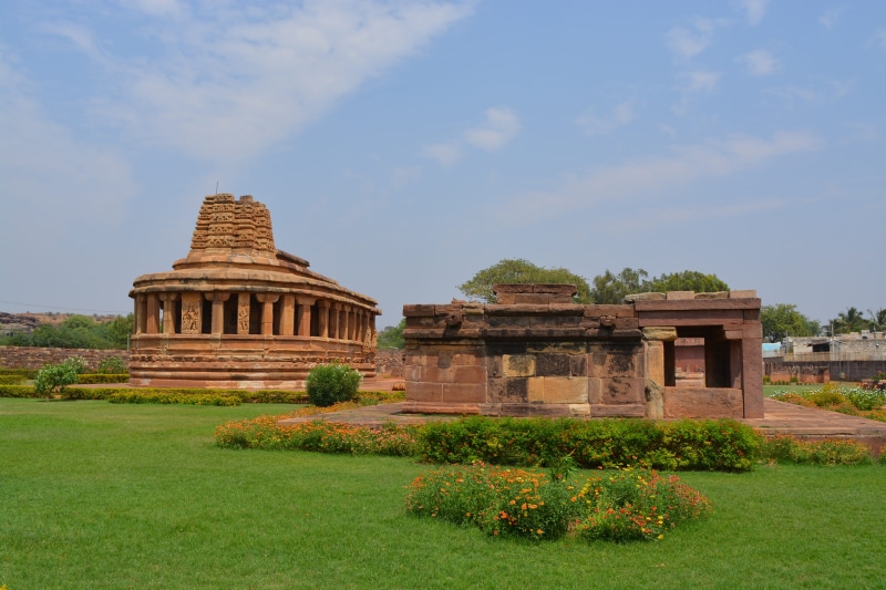 tourism, grass, ancient civilization, outdoors, old, architecture, famous, green color, place of worship, building exterior, culture, hampi, sky, traveler