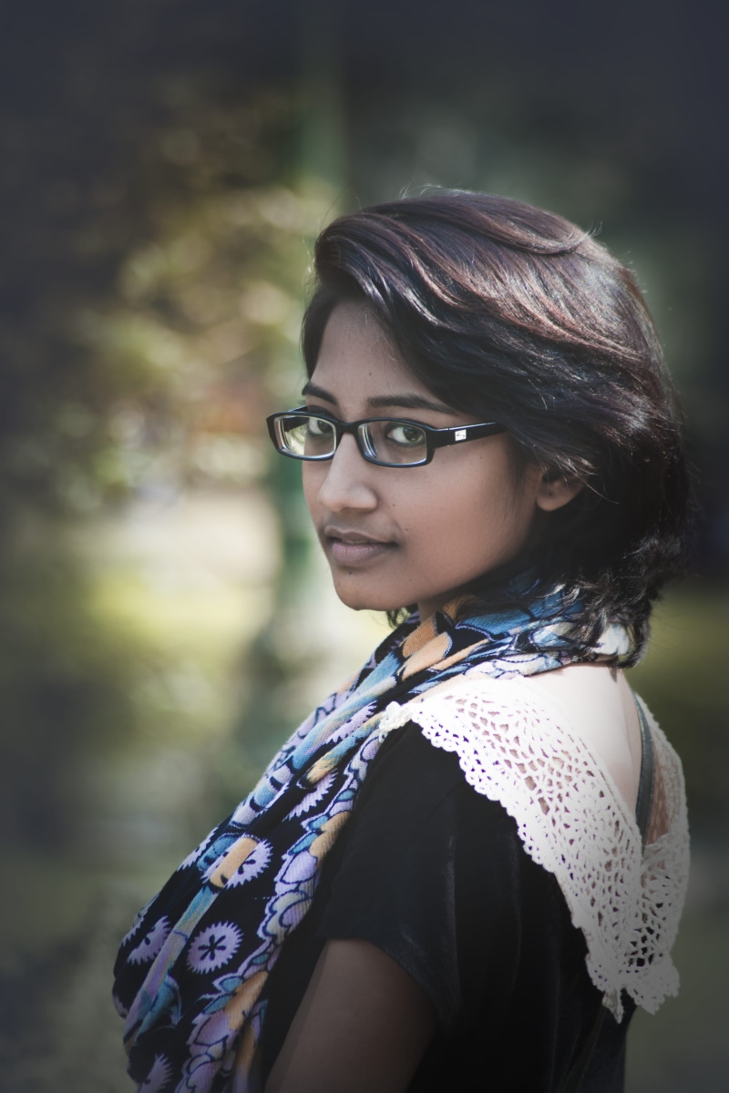 young women, eye, beautiful woman, adult, focus on foreground, outfoor, side view, glasses, smile, real people, india, smiling, people, girl, women, portrait