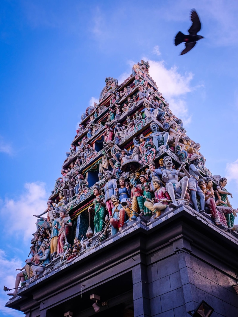 ornate, sculpture, indian, outdoors, flying, sky, architecture, built structure, cloud - sky, building, singapore, hindu, nature, sri mariamman temple