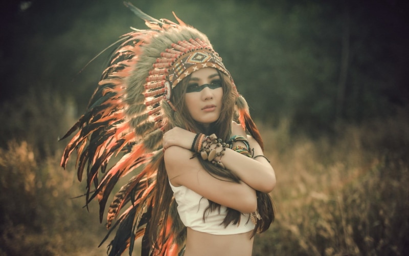 hairstyle, leisure activity, costume, brunette, face paint, long hair, lifestyles, contemplation, outdoors, nature, standing, 720P, one person, red, focus on foreground