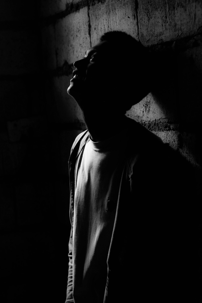 darkness, night, 5K, real people, dark, concrete, wall, one person, crew, brick, indoors, domestic room, black and white, rear view, pain, men, man, smile
