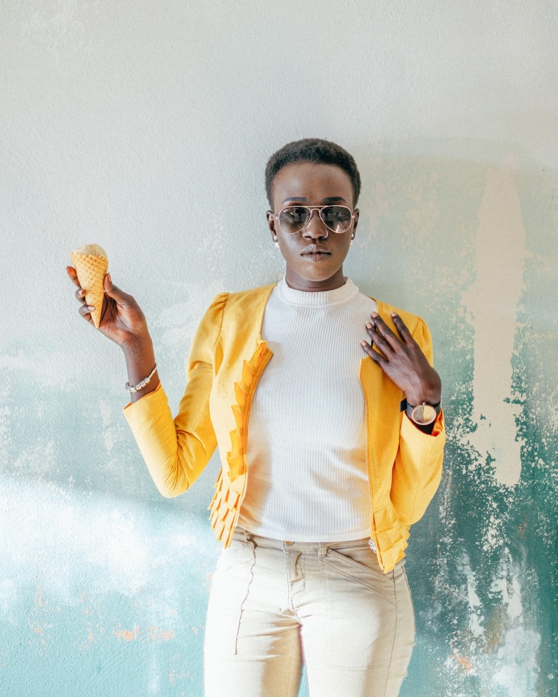 gray, ice, jacket, eat, cream, crew, watch, classy, painted, one person, young adult, taking, yellow, real people, style, indoors, black skin, looking at camera