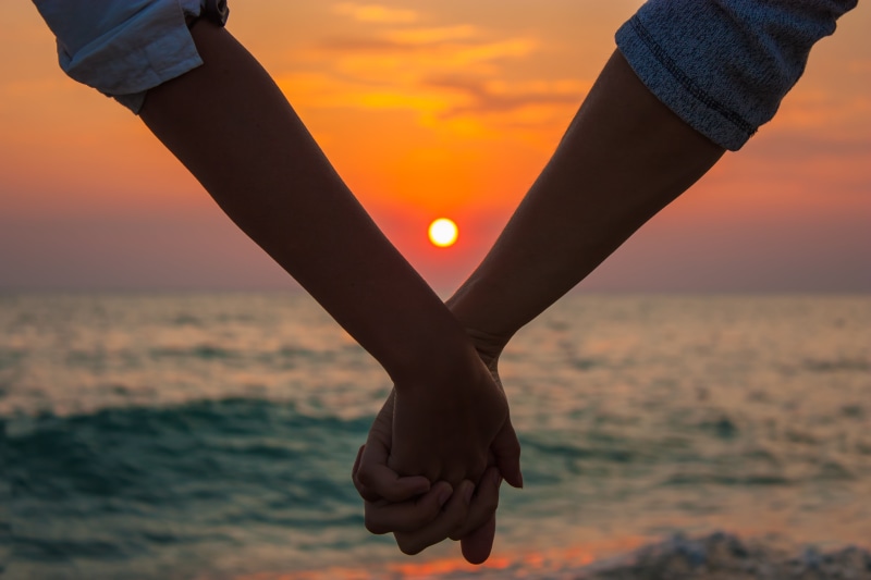 hand, orange color, close-up, body part, real people, relaxation, human limb, travel, hands, couple - Relationship, beach, adult, two, human body part
