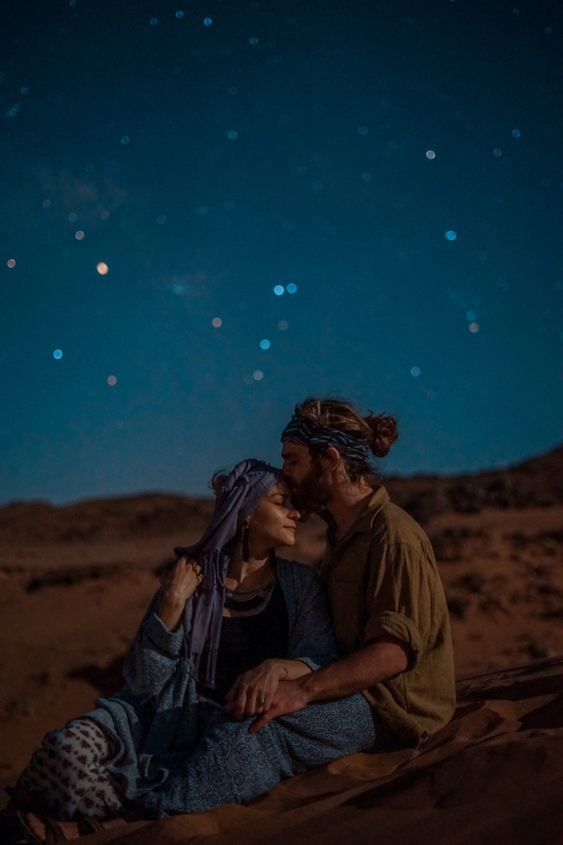 forehead kiss, man, outdoors, night, real people, sitting down, astronomy photography, togetherness, young men, young couple, nighttime, adult, starry sky