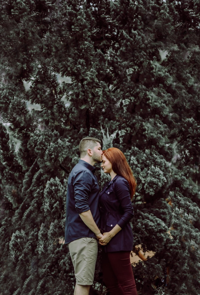 man, togetherness, outdoors, couple - relationship, costume, s, kiss, leisure activity, human, bonding, plant, casual clothing, women, nature, girl, bush