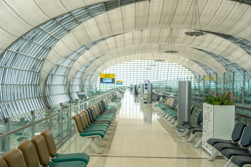 thailand, chair, direction, airport, interior, person, travel, architecture, seat, terminal, in a row, photo, flight, taking, window, no people, day, ceiling