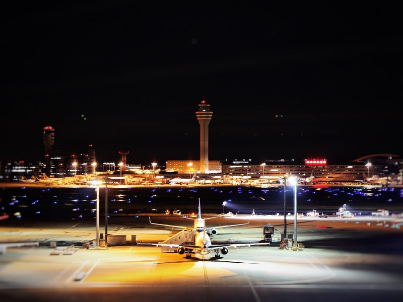 lighting equipment, skyscraper, architecture, japan, street, illuminated, stage, night, mode of transportation, light, built structure, aircraft, building exterior