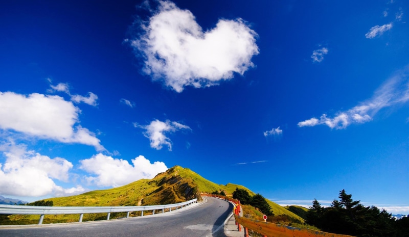 cloud - sky, idyllic, travel destinations, transportation, outdoors, environment, mountain, winding road, non-urban scene, plant, tranquility, no people