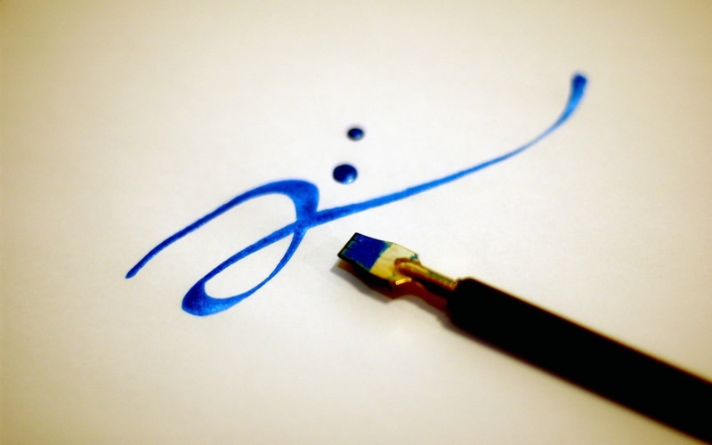 office supply, two objects, black, paper, creativity, network connection plug, still life, computer cable, art and craft, macro, writing instrument, fountain