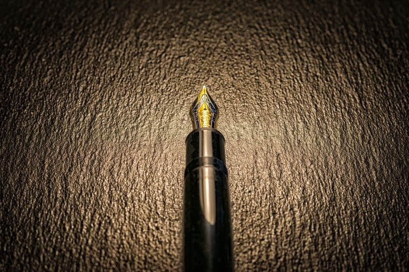 high angle view, black, writing instrument, art and craft, gold colored, gold, leave, filler, valuable, luxury, no people, single object, fountain, textured