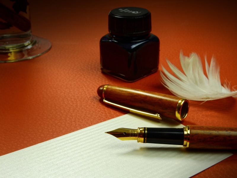fountain pen, document, two objects, quill pen, ornate, ink well, luxury, antique, table, indoors, inkwell, bottle, writing implement, paper, no people
