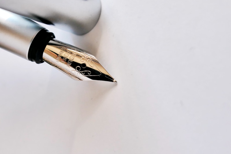 shadow, silver colored, single object, no people, ornate, ink, fountain, office supplies, writing instrument, white color, table, close, fountain pen, high angle view
