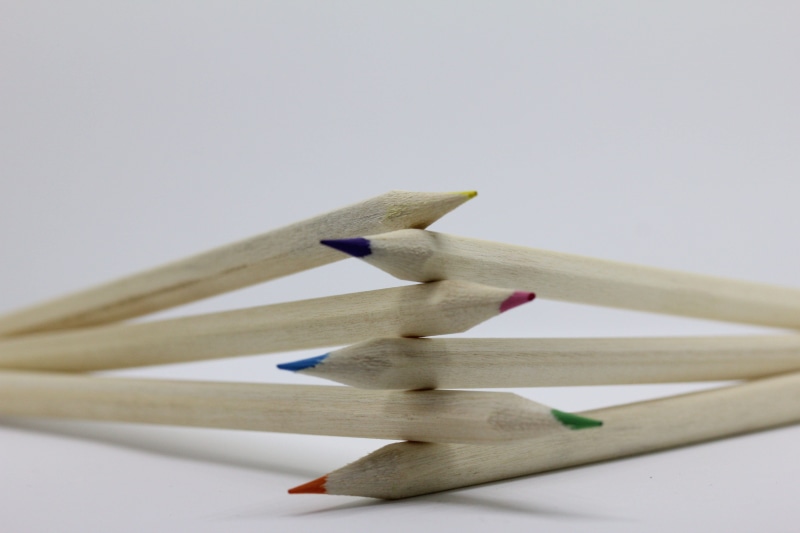 six, art and craft, education, color, copy space, addiction, crayon, school, wood - material, day, small group of objects, close-up, pencils, writing instrument