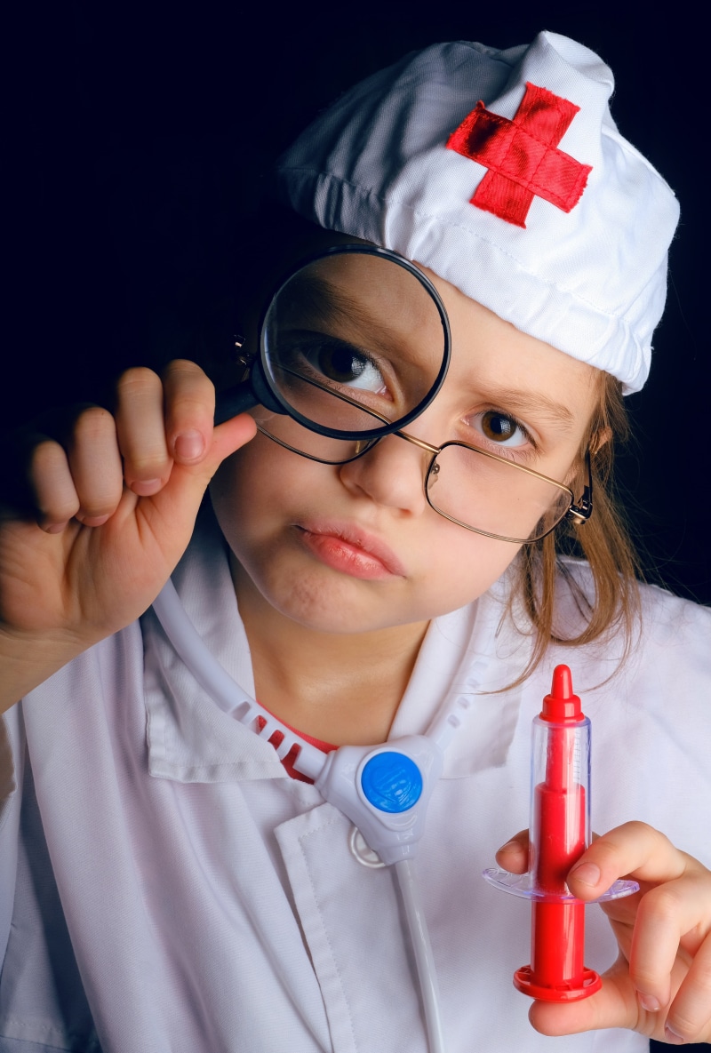 treatment, injections, game, emotions, holding, innocence, portrait, glasses, clothing, indoors, ambulance, front view, joke, childhood, eyeglasses, hat