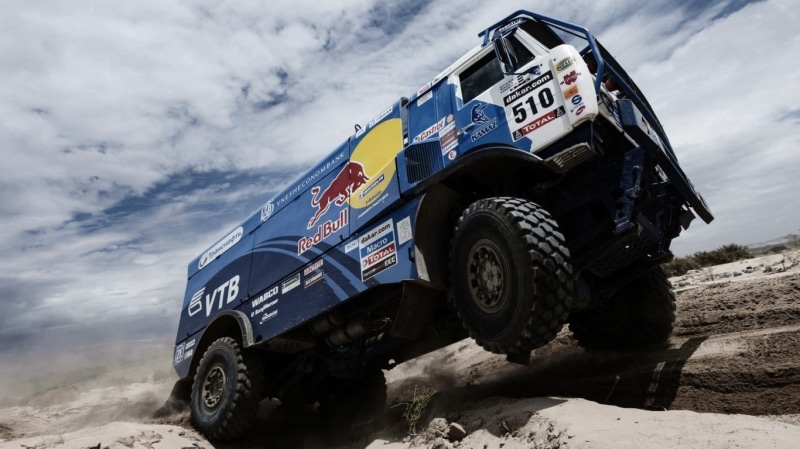 tire, sky, white, motor vehicle, low angle view, wheel, stationary, land, red, land vehicle, off-road vehicle, mode of transportation, blue, transportation