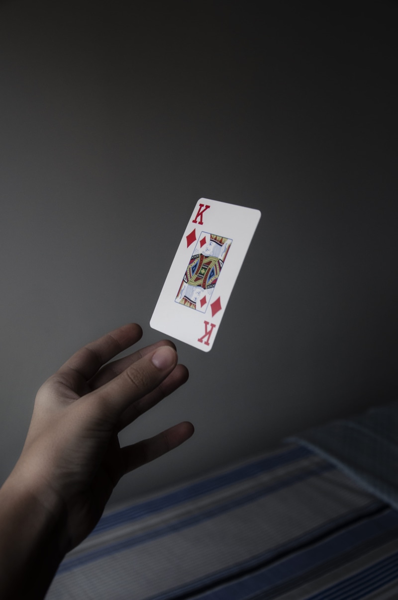 indoors, real people, finger, diamonds, king, luck, Joker, cards, one person, leisure activity, holding, floating, person, gambling, human body part, 4K