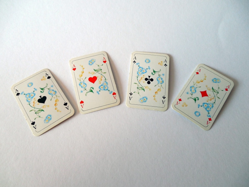 card game, win, ace, relaxation, close-up, cross, playing cards, white background, indoors, group of objects, profit, high angle view, poker - card game