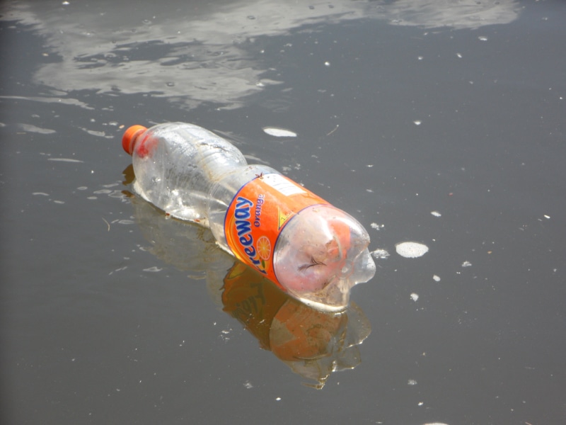 disposed of, water, reflection, waste, no people, body, high angle view, bottle, garbage, single object, communication, plastic, danube, thrown away, rescue