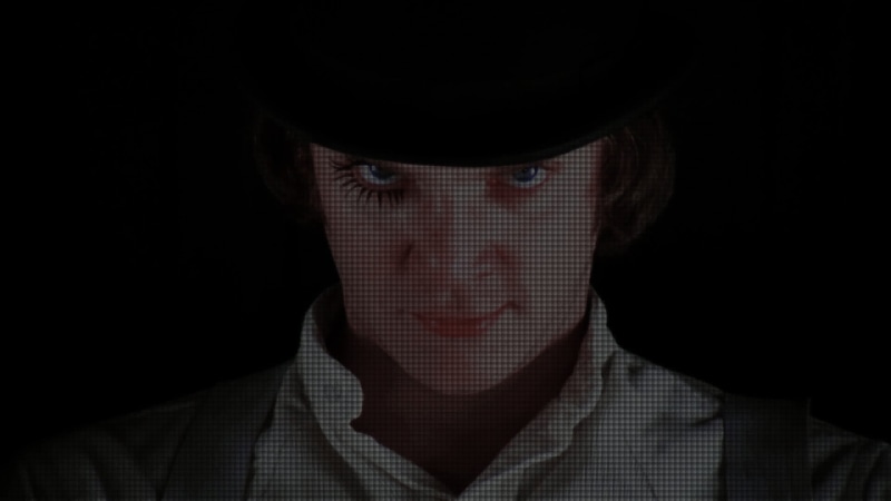 s, looking at camera, indoors, portrait, dark, clothing, Malcolm McDowell, face, cap, man, adult, movies, 1080P, black background, young adult, contemplation