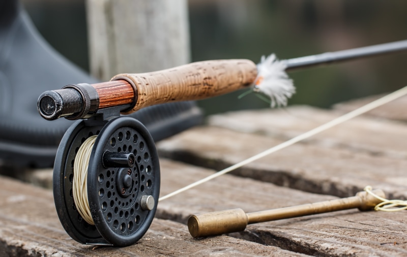 angling, black, outdoors, motion, leisure, old, trout fishing, fly fishing, pastime, water, no people, hobby, wood - material, metal, rod, brown, activity