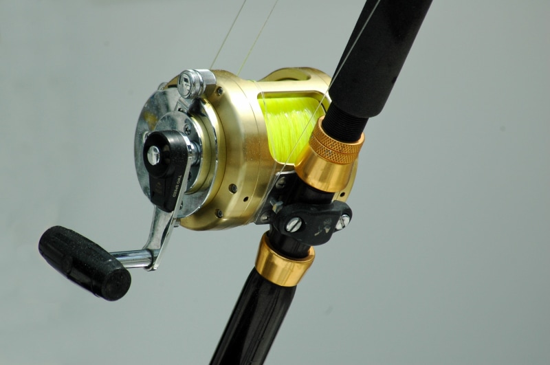 the past, blue, fish, spool, sea, recreational, rod, history, retro styled, white background, trolling, black color, fun, hobbies, single object, hobby