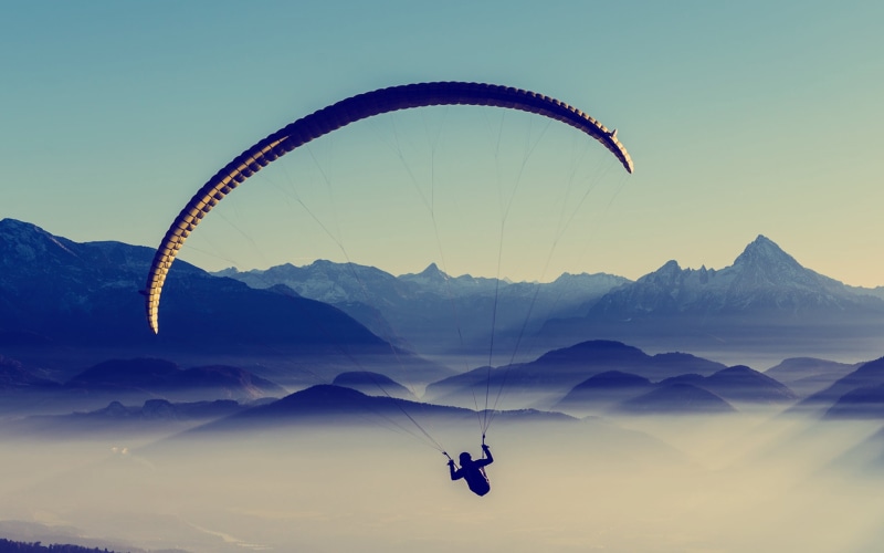 paragliding, one person, silhouette, flying, mountain range, scenics, unrecognizable person, travel, 2K, mid-Air, high Up, leisure Activity, blue, landscape