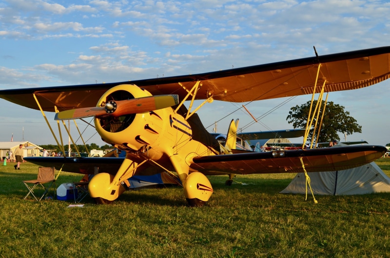 propeller, architecture, field, outdoors, plane, land, mode of transportation, airplane, 2K, aeroplane, biplane, plant, aviation, cloud - sky, sky, aircraft