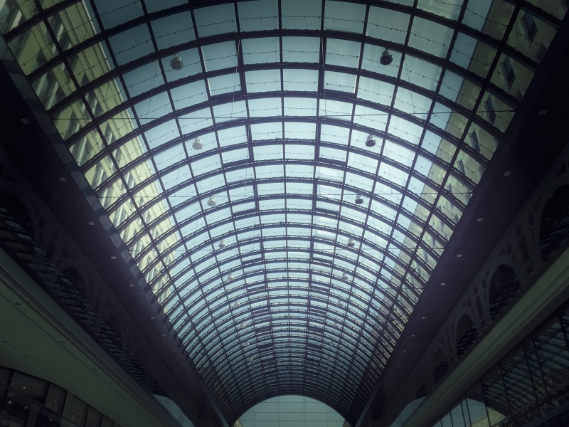 backgrounds, shopping mall, pattern, sunlight, building, glass, dome, skylight, indoors, low angle view, arch, glass - material, day, roof, no people, modern