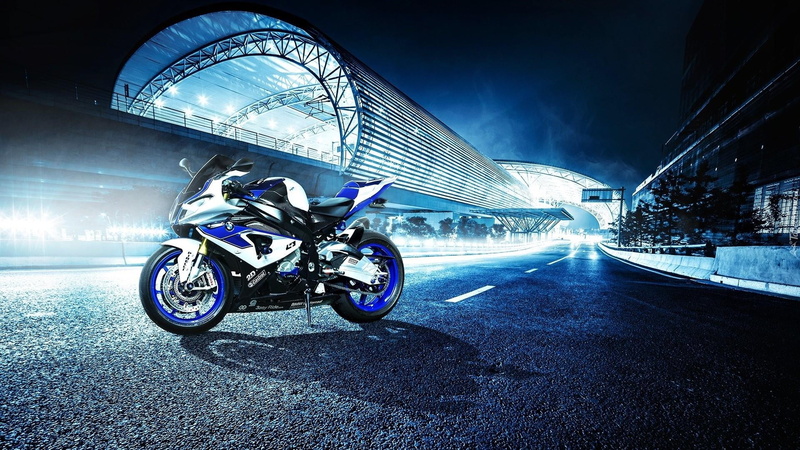 architecture, asphalt, travel, blurred motion, illuminated, bicycle, building exterior, land vehicle, built structure, street, motion, outdoors, night